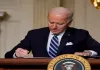 Biden signs defence bill despite objections to ban on transgender health care for military children