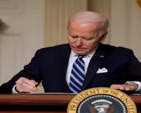 Biden signs defence bill despite objections to ban on transgender health care for military children