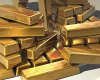 Gold futures rise on spot demand