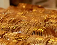 Gold futures rise on spot demand