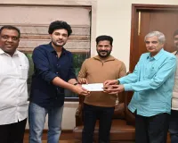 Siddu Jonnalagadda presents a cheque of 15 lakhs to CM Revanth Reddy    