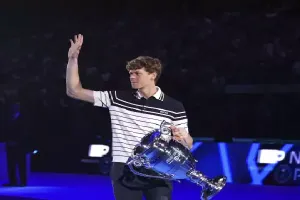 Sinner is awarded the trophy for finishing the year at No. 1 in the ATP rankings